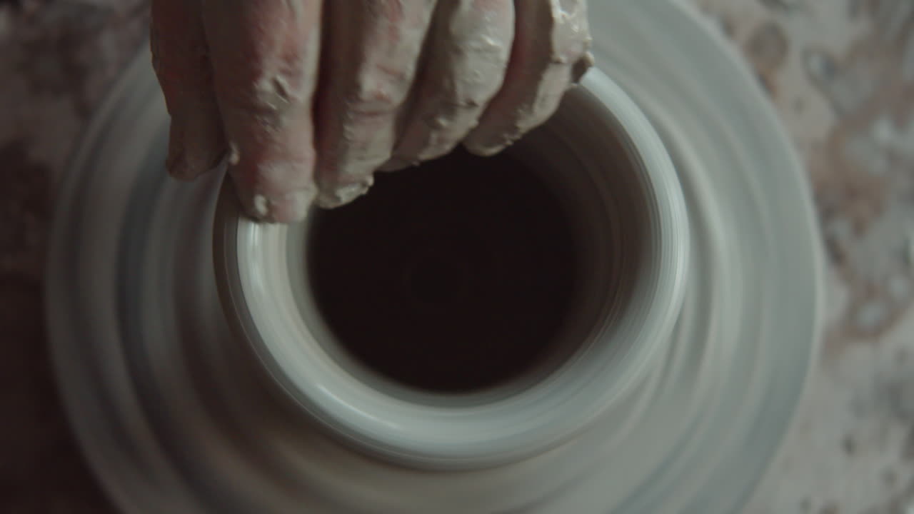 Male Hands Throwing Vase on Pottery Wheel