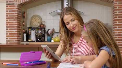 mother helping daughter doing homework