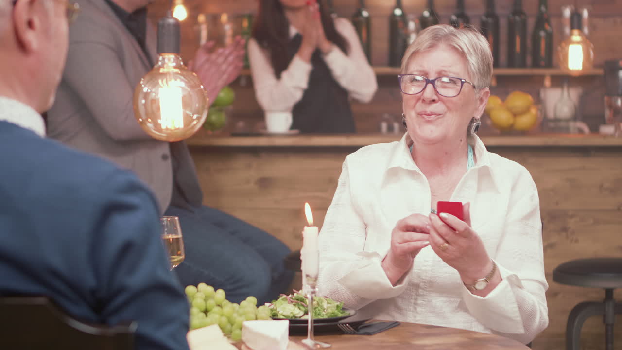 Man proposes to his girlfriend in a restaurant