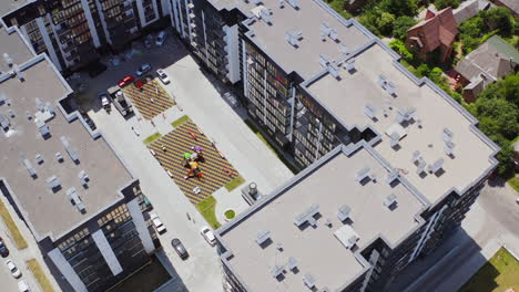 new high-rise housing apartments. modern residential complex with playground and parking places in the city. top aerial view.
