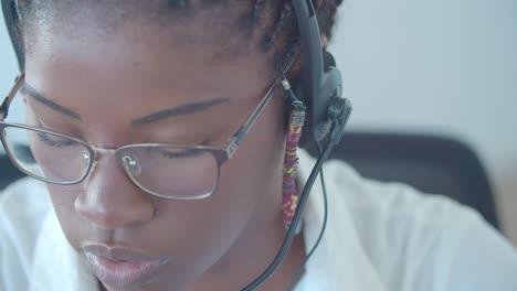 focused african american call center worker with dreads