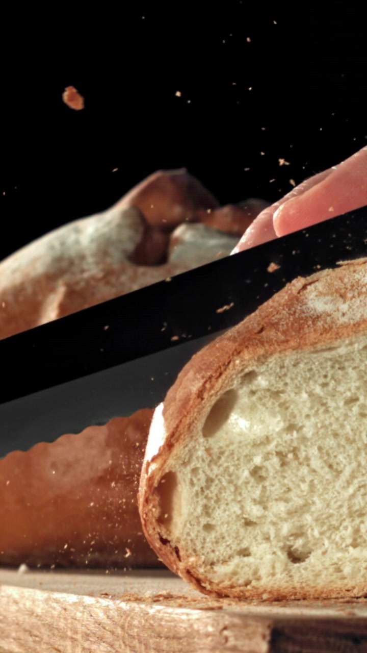 Slow Motion Slicing of Freshly Baked Bread