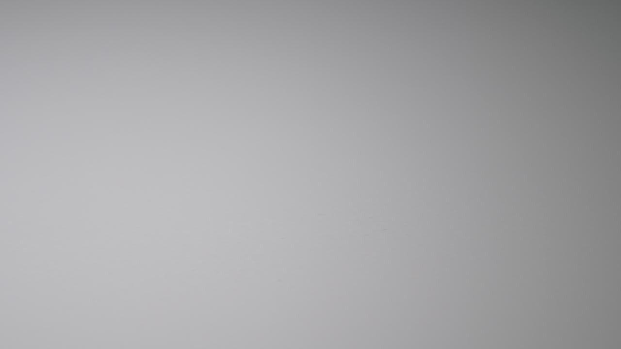 Panning past three capsules full of ground medical cannabis. Room for copy on left.