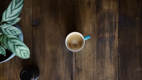 Flat-Lay-Placing-Coffee-Cup-With-Lens