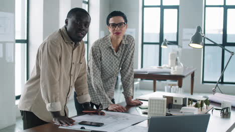 portrait of multiethnic male and female architects in office