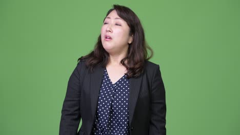 mature beautiful asian businesswoman looking bored