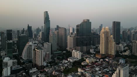 marvel at bangkok's skyline during golden hour with stunning aerial footage