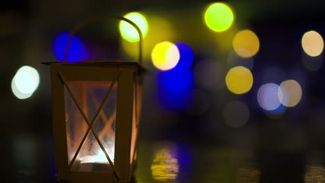 outdoor lantern candle inside stirring with wind