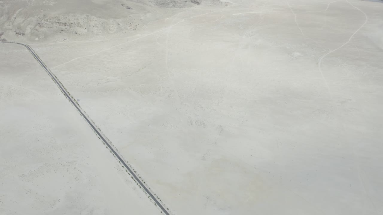 a narrow road cutting across Skardu’s vast cold desert in Gilgit-Baltistan, Pakistan