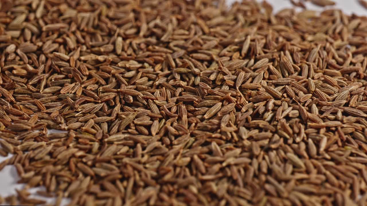 cumin seeds or jeera close up, parallax shot, 4k