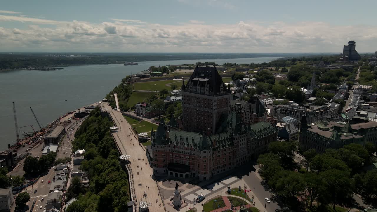 Slow spinning shot of Hotel Chateau Frontenac during warm holiday, Aerial