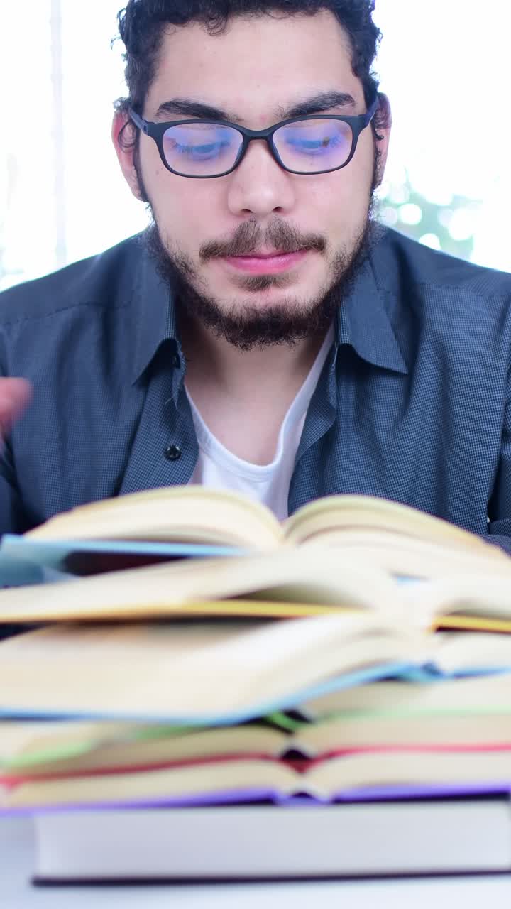 Young Student Studying with Books and Drinking Coffee