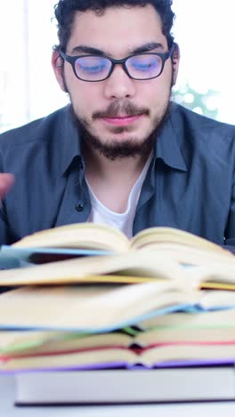 young student studying with books and drinking coffee