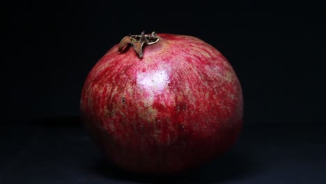 the light moves to the left on the pomegranate in the dark