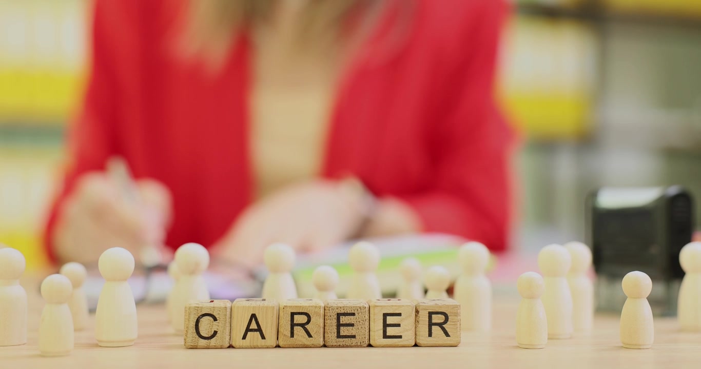 Word career from cubes against woman turning pages of diary