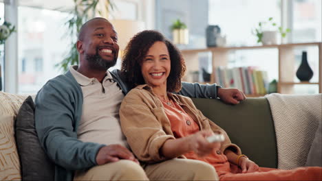 happy couple watching tv