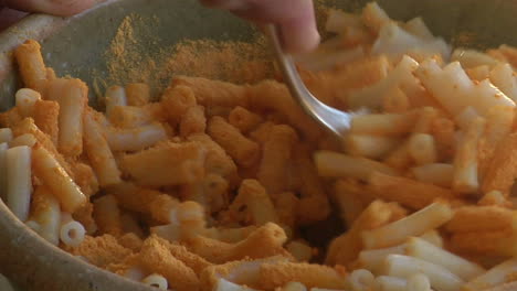 macaroni is stirred in a bowl 2