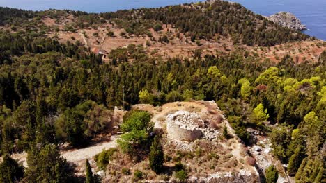 remains of venetian watchtower assos castle, asos, kefalonia, ionian islands, greece - aerial drone shot