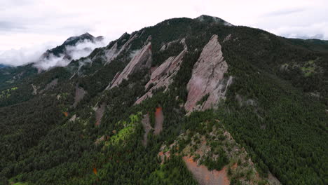 aerial pullback view of scenic flatirons in chautauqua park, boulder, colorado