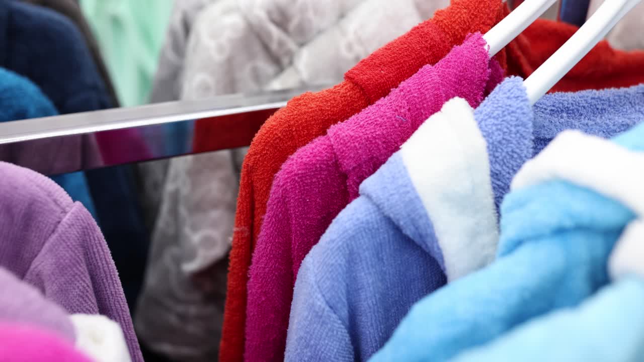 Colorful bathrobes on a rack