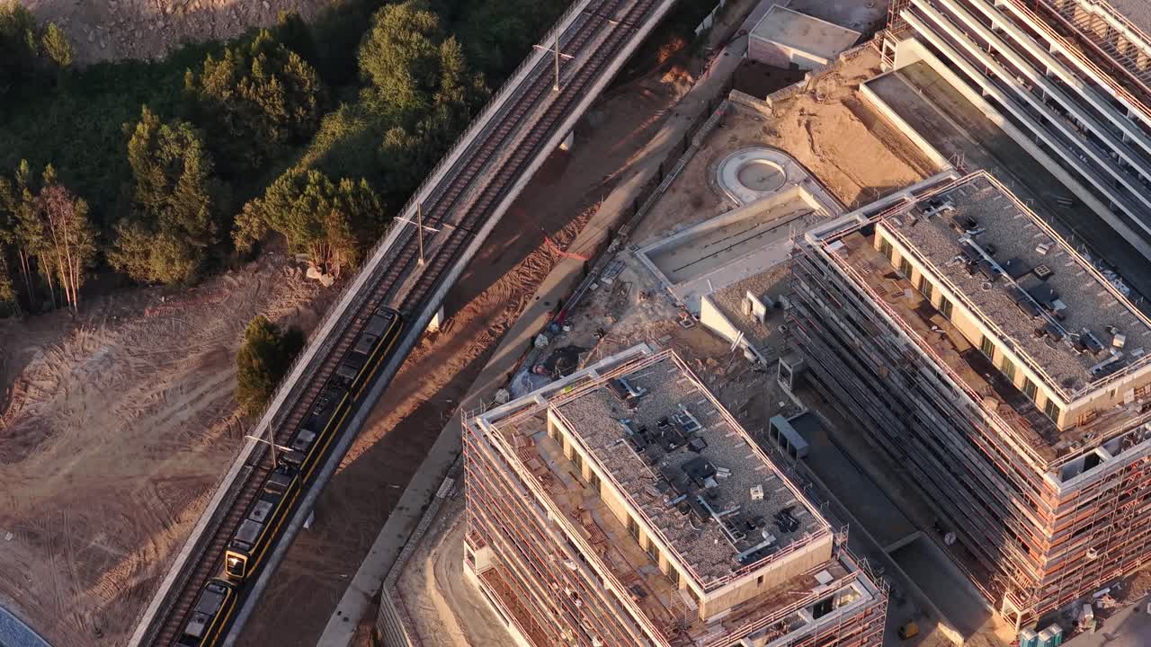 Subway passing near buildings under construction
