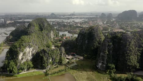 Cinematic-drone-shot-of-Tam-Coc-in-Ninh-Binh-Vietnam