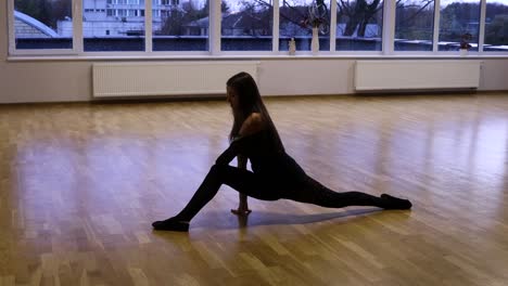 female dancer stretching before dancing