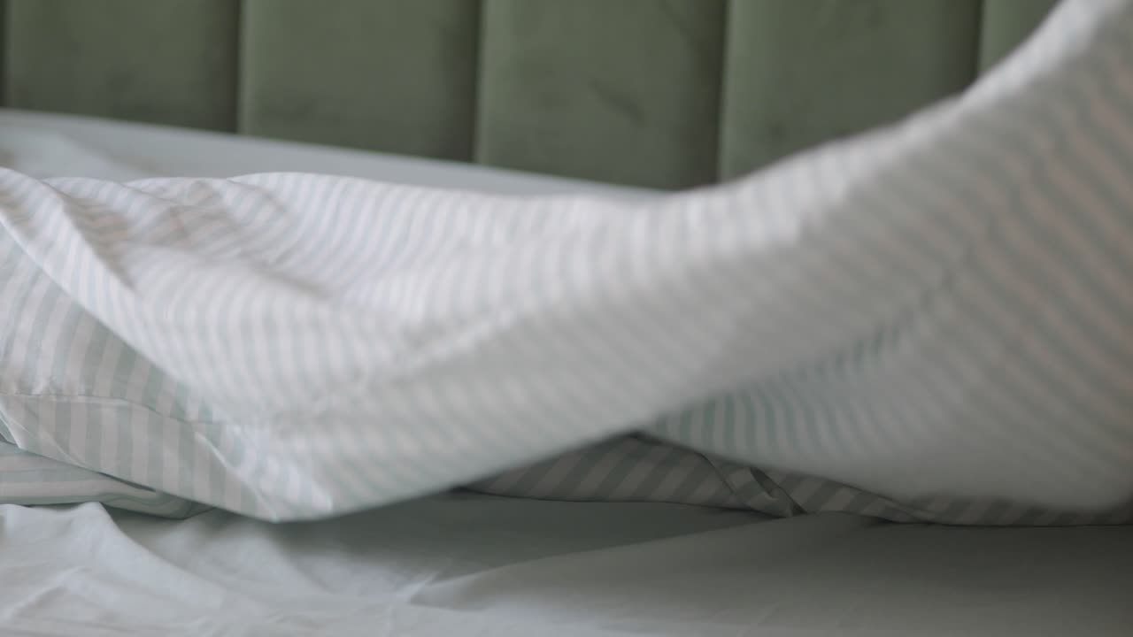 Bed with Striped Linens