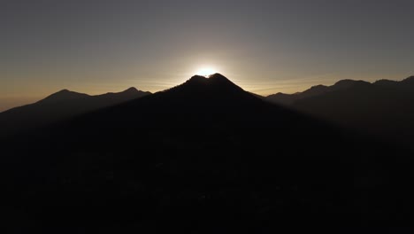 Aerial-view-of-a-sunrise-behind-a-mountain-in-matliwaka