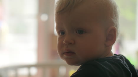 A-closeup-of-a-baby-girls-face-who-is-thoughtfully-looking-into-the-distance