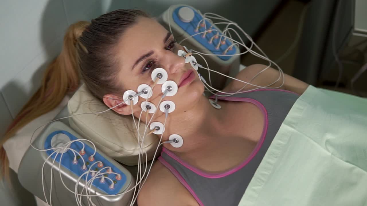 Woman undergoing facial microcurrent treatment