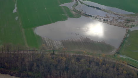 farm fields submerged in floodwater after heavy rainstorm in british columbia, canada