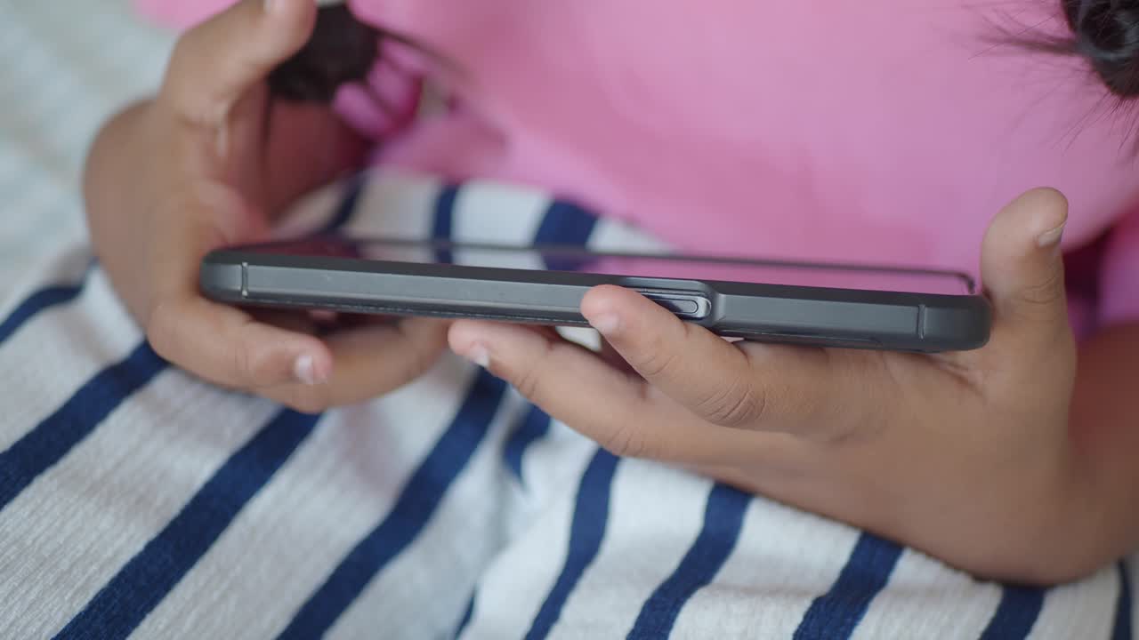 Child holding a smartphone