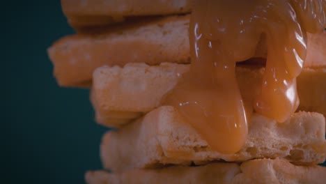 pouring caramel on spinning waffles