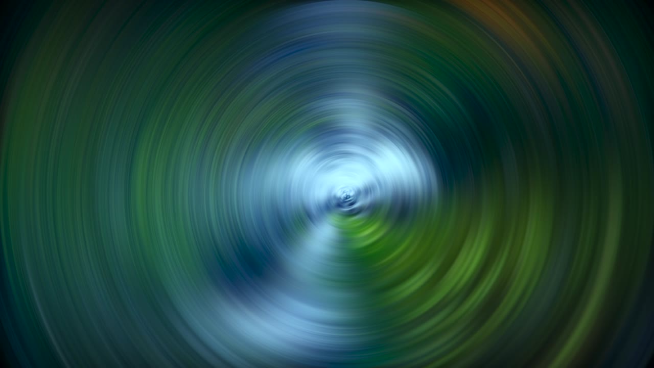 luces en movimiento en una imagen que forman un molinillo redondo giratorio con los colores suaves en verde, azul y blanco