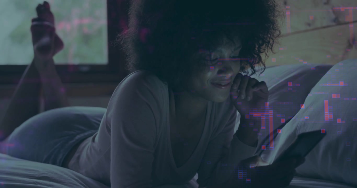 Woman lying on bed tapping phone, causing pink overlay flowing around phone, smiling at social app