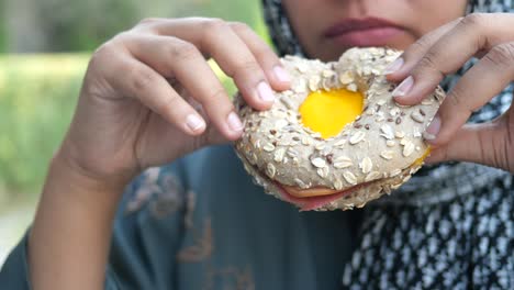 woman eating a sandwich