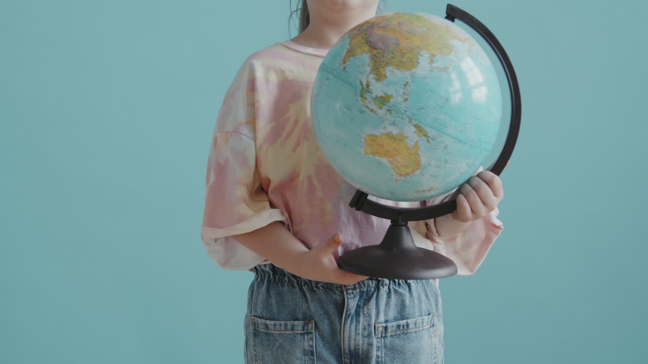 Portrait of 8-Year-Old Girl with World Globe