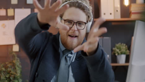 funny businessman posing in office