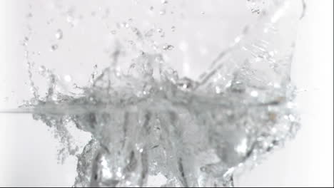 ice cubes falling in super slow motion into water