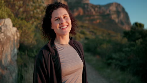 smiling woman hiking in mountains