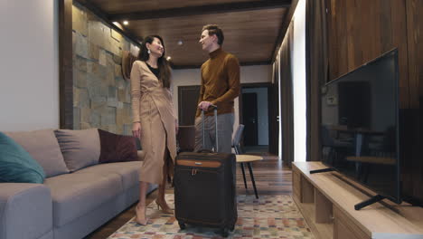 couple checking in to a modern hotel room