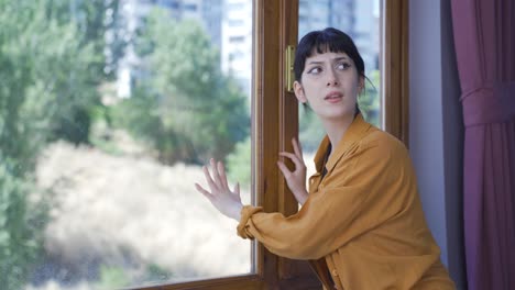 the young woman shouting for help from the window.