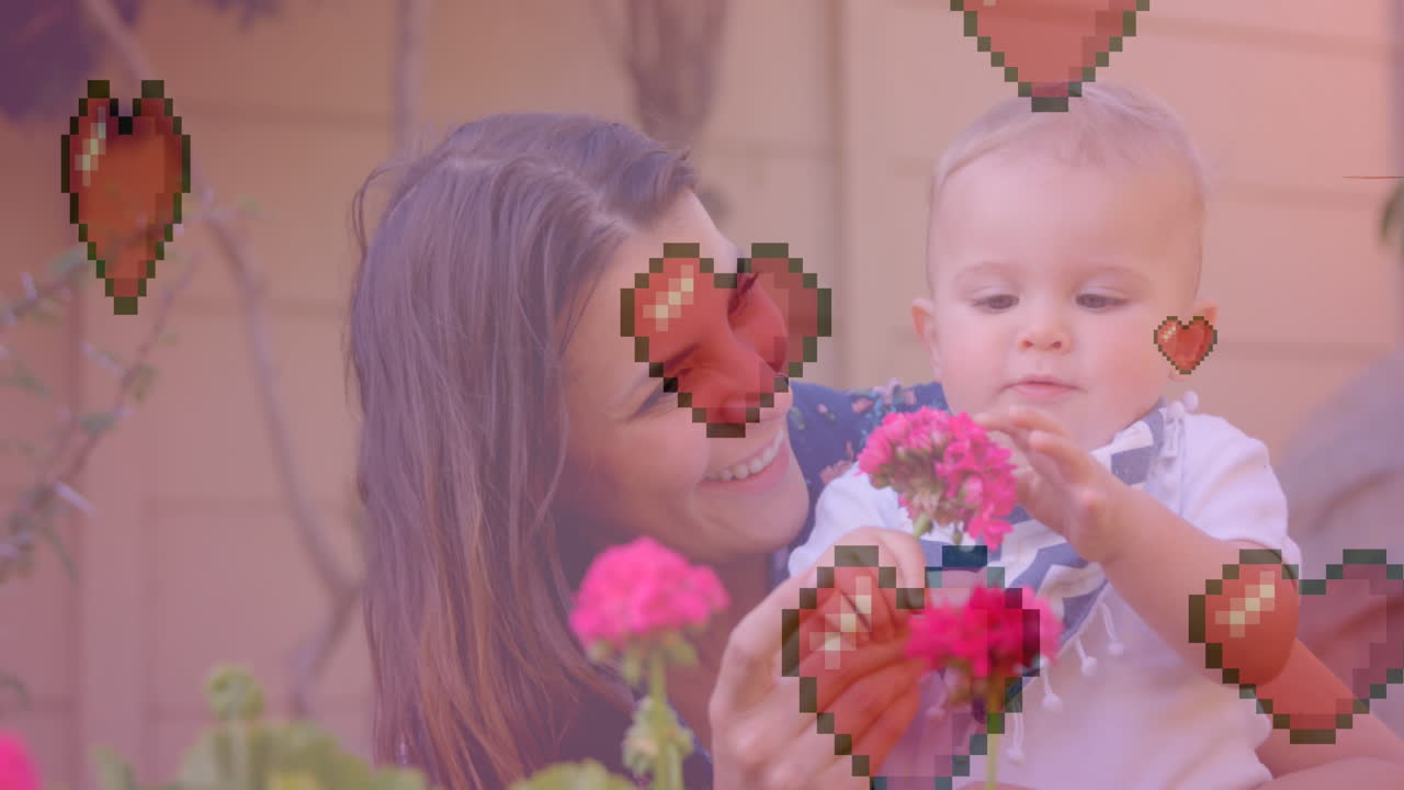 아기 꽃을 들고 있는 백인 어머니 위에 있는 심장 아이콘의 애니메이션