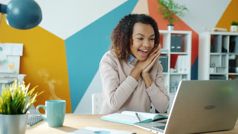 woman excitedly reacts to surprise online