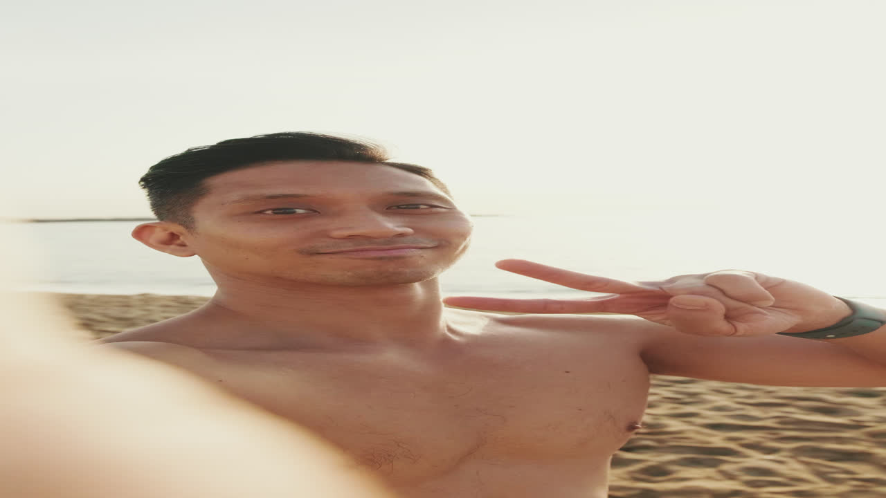 Shirtless man on a beach