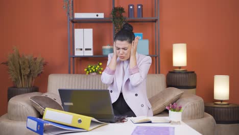 Home-office-worker-young-woman-says-shhh-to-camera.