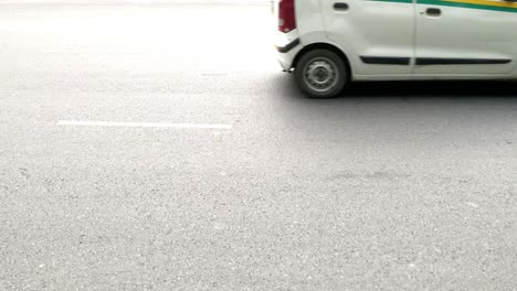 the movement of vehicles cars bikes on india gate circle in delhi