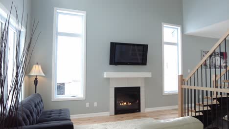 modern living room with tall ceiling and fireplace smooth pov entry real estate