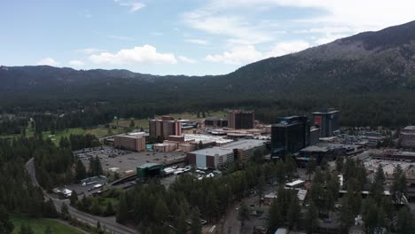 Wide-panning-aerial-shot-of-the-casinos-in-Stateline,-Nevada-along-the-shores-of-Lake-Tahoe